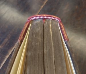 Overhead view of headband and text block of book